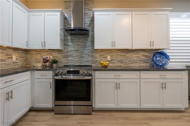 Step into modern luxury with this completely renovated Osprey on Herons Glen Golf and Country Club in Florida - for sale on GolfHomes.com, golf home, golf lot