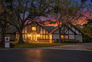 One or more photo(s) has been virtually staged. *Tudor Style*
 on Feather Sound Country Club in Florida - for sale on GolfHomes.com, golf home, golf lot