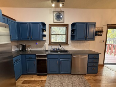 Beautiful getaway in Angel Fire only 1.7 mi from the ski base on Angel Fire Resort Country Club in New Mexico - for sale on GolfHomes.com, golf home, golf lot