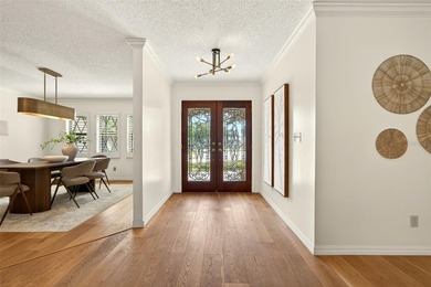 One or more photo(s) has been virtually staged. *Tudor Style*
 on Feather Sound Country Club in Florida - for sale on GolfHomes.com, golf home, golf lot