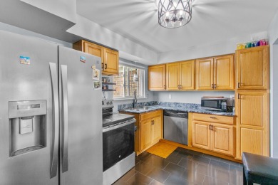 This spacious upper unit features a large living room, two on Beech Woods Golf Course in Michigan - for sale on GolfHomes.com, golf home, golf lot
