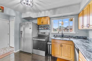 This spacious upper unit features a large living room, two on Beech Woods Golf Course in Michigan - for sale on GolfHomes.com, golf home, golf lot