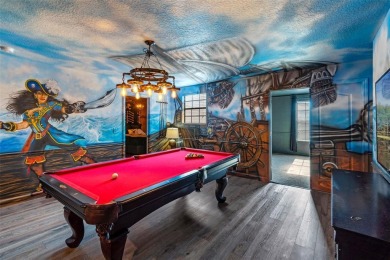 Step into the magical realm of this beautifully themed on The Oasis Club at Champions Gate in Florida - for sale on GolfHomes.com, golf home, golf lot