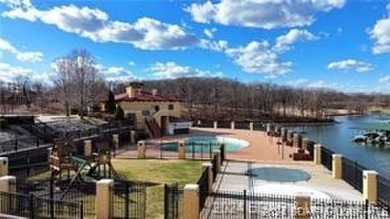 Looking to enjoy all the Lake of the Ozarks has to offer? Then on The Club At Porto Cima in Missouri - for sale on GolfHomes.com, golf home, golf lot