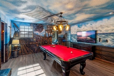 Step into the magical realm of this beautifully themed on The Oasis Club at Champions Gate in Florida - for sale on GolfHomes.com, golf home, golf lot