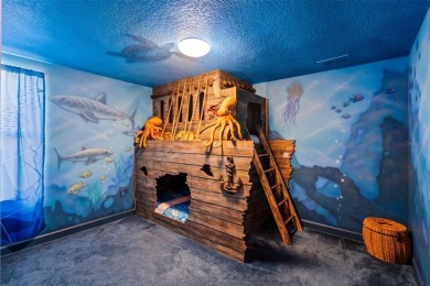 Step into the magical realm of this beautifully themed on The Oasis Club at Champions Gate in Florida - for sale on GolfHomes.com, golf home, golf lot