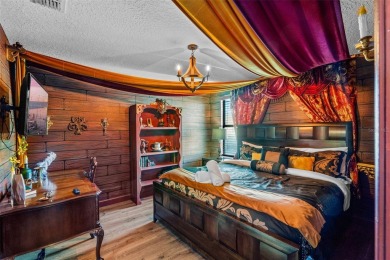 Step into the magical realm of this beautifully themed on The Oasis Club at Champions Gate in Florida - for sale on GolfHomes.com, golf home, golf lot