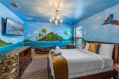 Step into the magical realm of this beautifully themed on The Oasis Club at Champions Gate in Florida - for sale on GolfHomes.com, golf home, golf lot