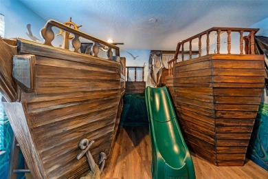Step into the magical realm of this beautifully themed on The Oasis Club at Champions Gate in Florida - for sale on GolfHomes.com, golf home, golf lot