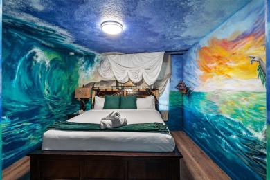Step into the magical realm of this beautifully themed on The Oasis Club at Champions Gate in Florida - for sale on GolfHomes.com, golf home, golf lot