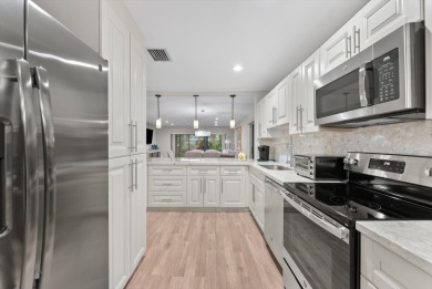 Welcome home to this  spacious 2-bedroom, 2-bath ground-floor on Hunters Run Golf and Country Club in Florida - for sale on GolfHomes.com, golf home, golf lot