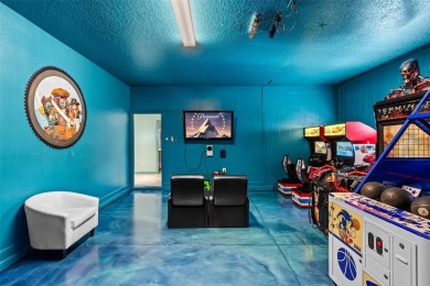 Step into the magical realm of this beautifully themed on The Oasis Club at Champions Gate in Florida - for sale on GolfHomes.com, golf home, golf lot