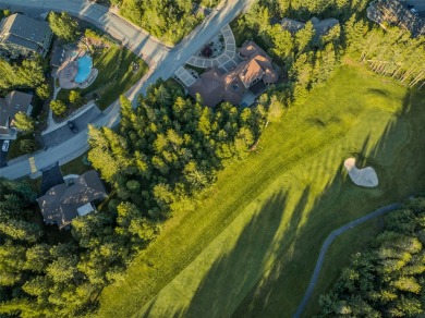 Nestled amongst tall pines overlooking the 6th green of the Golf on Meadow Lake Golf Resort in Montana - for sale on GolfHomes.com, golf home, golf lot