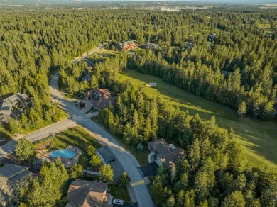 Nestled amongst tall pines overlooking the 6th green of the Golf on Meadow Lake Golf Resort in Montana - for sale on GolfHomes.com, golf home, golf lot