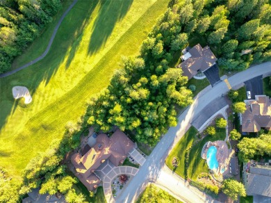 Nestled amongst tall pines overlooking the 6th green of the Golf on Meadow Lake Golf Resort in Montana - for sale on GolfHomes.com, golf home, golf lot