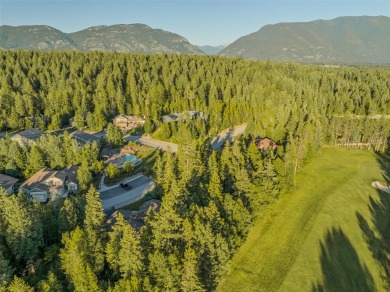 Nestled amongst tall pines overlooking the 6th green of the Golf on Meadow Lake Golf Resort in Montana - for sale on GolfHomes.com, golf home, golf lot