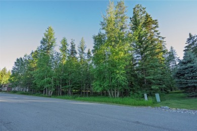 Nestled amongst tall pines overlooking the 6th green of the Golf on Meadow Lake Golf Resort in Montana - for sale on GolfHomes.com, golf home, golf lot