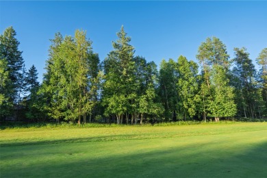 Nestled amongst tall pines overlooking the 6th green of the Golf on Meadow Lake Golf Resort in Montana - for sale on GolfHomes.com, golf home, golf lot