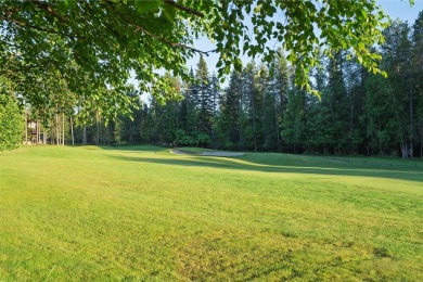 Nestled amongst tall pines overlooking the 6th green of the Golf on Meadow Lake Golf Resort in Montana - for sale on GolfHomes.com, golf home, golf lot