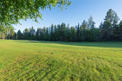 Nestled amongst tall pines overlooking the 6th green of the Golf on Meadow Lake Golf Resort in Montana - for sale on GolfHomes.com, golf home, golf lot