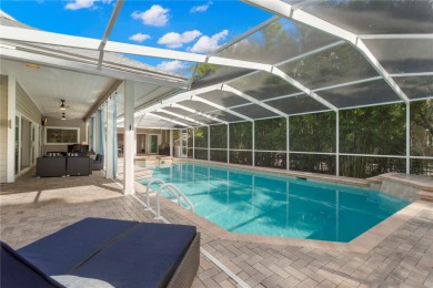 Under contract-accepting backup offers. Modern architectural on Feather Sound Country Club in Florida - for sale on GolfHomes.com, golf home, golf lot