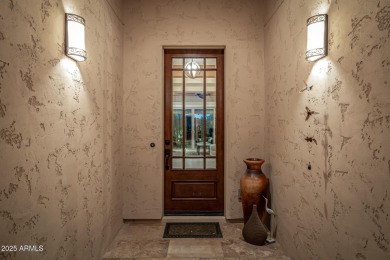 Classy Treviso home presenting curb appeal that makes you want on Tuscany Falls At Pebble Creek in Arizona - for sale on GolfHomes.com, golf home, golf lot