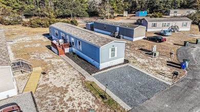 This beautiful like new 2021 Clayton manufactured home in the on Tidewater Golf Club and Plantation in South Carolina - for sale on GolfHomes.com, golf home, golf lot
