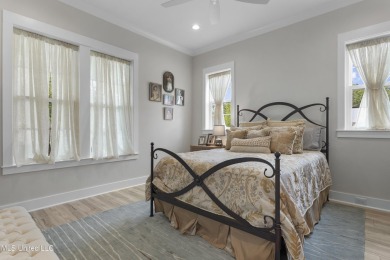 Located in the highly sought-after golf cart district of on Gulf Hills Golf Club in Mississippi - for sale on GolfHomes.com, golf home, golf lot