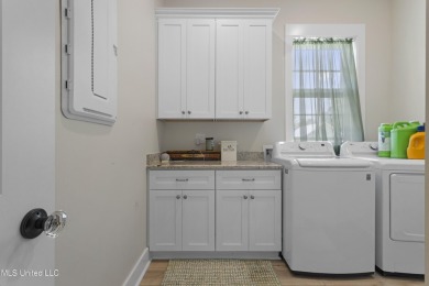 Located in the highly sought-after golf cart district of on Gulf Hills Golf Club in Mississippi - for sale on GolfHomes.com, golf home, golf lot