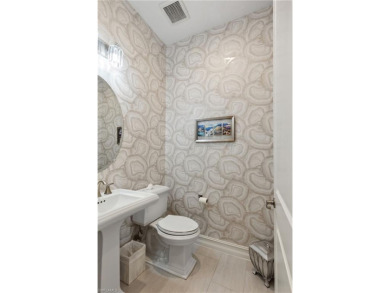 Discover the epitome of luxury living in this exceptional on The Golf Club At Fiddlers Creek in Florida - for sale on GolfHomes.com, golf home, golf lot