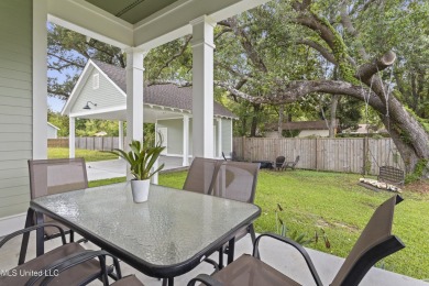 Located in the highly sought-after golf cart district of on Gulf Hills Golf Club in Mississippi - for sale on GolfHomes.com, golf home, golf lot