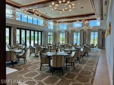 Discover the epitome of luxury living in this exceptional on The Golf Club At Fiddlers Creek in Florida - for sale on GolfHomes.com, golf home, golf lot