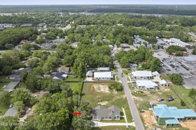 Located in the highly sought-after golf cart district of on Gulf Hills Golf Club in Mississippi - for sale on GolfHomes.com, golf home, golf lot