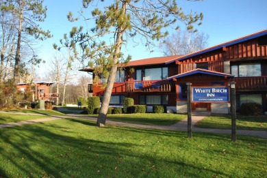 SKI SLOPE FRONT & GOLF FRONT END UNIT CONDO in the heart of the on The Otsego Club/The Tribute in Michigan - for sale on GolfHomes.com, golf home, golf lot