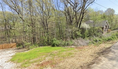 Buildable lot with water and sewer access steps from the on Bella Vista - Metfield Golf Complex and Country Club in Arkansas - for sale on GolfHomes.com, golf home, golf lot