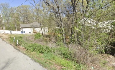 Buildable lot with water and sewer access steps from the on Bella Vista - Metfield Golf Complex and Country Club in Arkansas - for sale on GolfHomes.com, golf home, golf lot