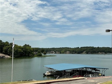 Buildable lot with water and sewer access steps from the on Bella Vista - Metfield Golf Complex and Country Club in Arkansas - for sale on GolfHomes.com, golf home, golf lot