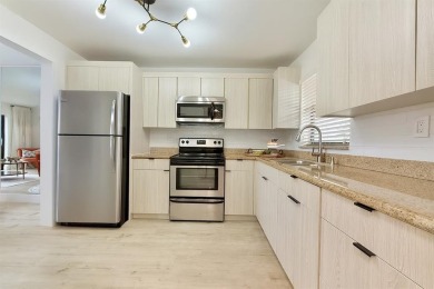 FULLY RENOVATED first-floor 2 bedroom/1.5 baths with screened on Sunrise Lakes Phase III in Florida - for sale on GolfHomes.com, golf home, golf lot