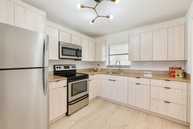 FULLY RENOVATED first-floor 2 bedroom/1.5 baths with screened on Sunrise Lakes Phase III in Florida - for sale on GolfHomes.com, golf home, golf lot