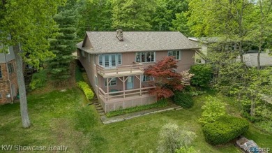 WONDERFUL RANCH HOME WITH LL WALK-OUT IS NESTLED AMONG THE TREES on Lakelands Golf and Country Club in Michigan - for sale on GolfHomes.com, golf home, golf lot