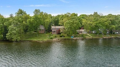 WONDERFUL RANCH HOME WITH LL WALK-OUT IS NESTLED AMONG THE TREES on Lakelands Golf and Country Club in Michigan - for sale on GolfHomes.com, golf home, golf lot