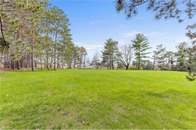 Great buildable lot with lots of pine trees and access to on New Richmond Golf Club in Wisconsin - for sale on GolfHomes.com, golf home, golf lot