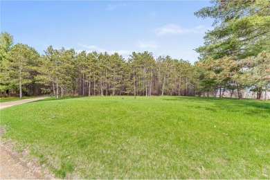 Great buildable lot with lots of pine trees and access to on New Richmond Golf Club in Wisconsin - for sale on GolfHomes.com, golf home, golf lot