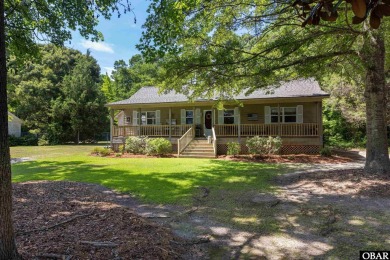 This low country home welcomes you!  The covered front porch on Holly Ridge Golf Course in North Carolina - for sale on GolfHomes.com, golf home, golf lot