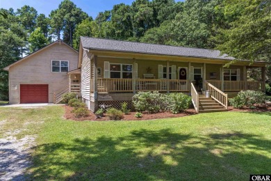 This low country home welcomes you!  The covered front porch on Holly Ridge Golf Course in North Carolina - for sale on GolfHomes.com, golf home, golf lot