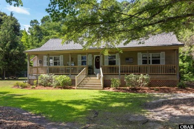 This low country home welcomes you!  The covered front porch on Holly Ridge Golf Course in North Carolina - for sale on GolfHomes.com, golf home, golf lot