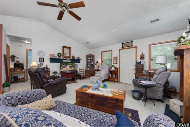 This low country home welcomes you!  The covered front porch on Holly Ridge Golf Course in North Carolina - for sale on GolfHomes.com, golf home, golf lot
