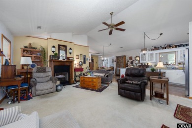 This low country home welcomes you!  The covered front porch on Holly Ridge Golf Course in North Carolina - for sale on GolfHomes.com, golf home, golf lot