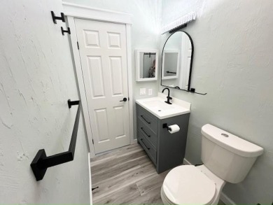 Beautifully renovated 2BD/2BA stucco home perfectly blends on Del Tura Golf and Country Club in Florida - for sale on GolfHomes.com, golf home, golf lot