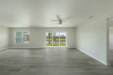 This nearly completed WATERFRONT TRIPLEX in Rotonda West, FL, is on Rotonda Golf and Country Club The Palms Course in Florida - for sale on GolfHomes.com, golf home, golf lot
